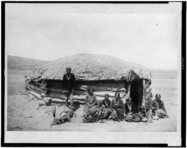 Navajo family outside a hogan, 1906

Schwemberger, Simeon, photographer. Dine Tsosi's hogan. Photograph. Retrieved from the Library of Congress, <www.loc.gov/item/90715670/>.